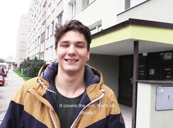 CH 484, Camera guy pays a young guy in a black T and a brown and blue hooded jacket,