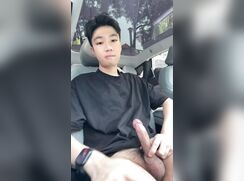 Jerking his big dick in a car and cumming on the seat