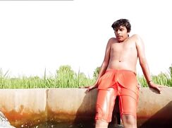 Desi twink wear orange shorts in tubewell