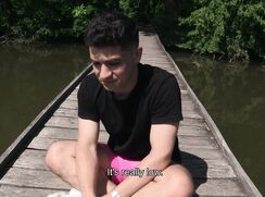 CH 550, Camera guy pays a young guy in black T and pink shorts on a lakes mooring pat