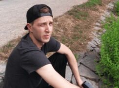 CH 552, Camera guy pays a young guy in grey T and a black and grey baseball cap to su