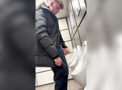 hung fit lad pissing