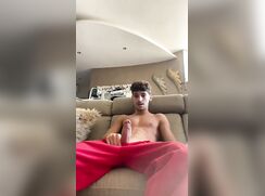 Latino guy kicking back and rubbing one out