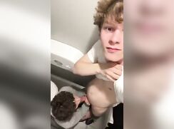 A couple messing around in the restroom