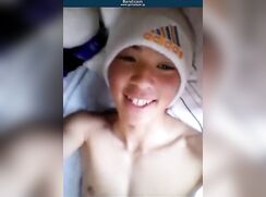 Asian stud in white addidas beanie