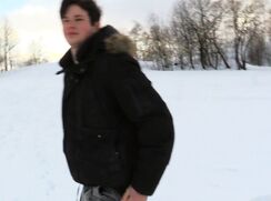 CH 605, Camera guy pays a young guy in black parka walking on a snowed out hill to su