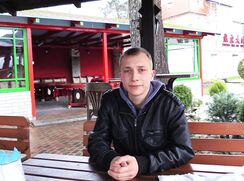 CH 613, Camera guy pays a young guy in a black jacket and a blue hoodie, sitting on a