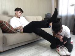 Giving a foot massage to a handsome guy