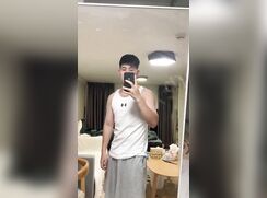 Muscle jock stroking in front of the mirror