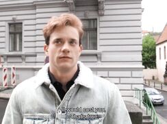 CH 619, Camera guy pays a young guy in a light grey denim jacket with a fleece collar