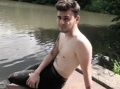 CH 629, Camera guy pays a bare-chested young guy in black jeans, sitting on a water o