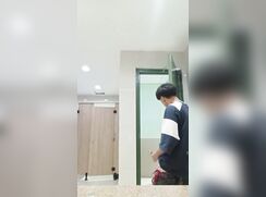 Asian boy standing by the door