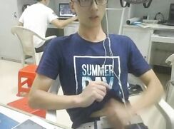 College boy jerks off in study room with others around