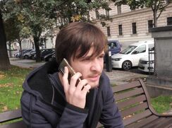 CH 670, Camera guy pays a young guy in a dark grey hooded jacket and black jeans, to