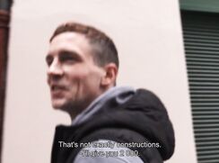 CH 677, Camera guy pays a young guy in a grey hoodie and a black Gilet, walking down