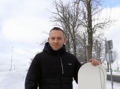 CH 682, Camera guy pays a young guy in a black quilted hooded jacket and a ski board,