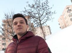 CH 683, Camera guy pays a young guy in a purple quilted hooded jacket, on his way to