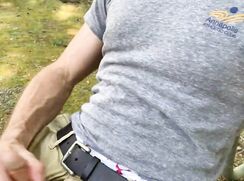 Dude taking a walk outdoors stops for a jerkoff break