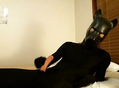 Black zentai pup makes a mess - Zentai2