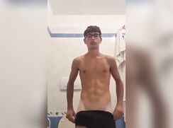 Nerdy uncut Latino with big dick jerks in the bathroom