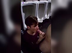 Cute lad sucks cock in public restroom