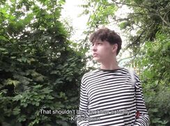 CH 706, Camera guy pays a young guy in a black and white stiped top, walking down a b