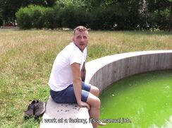 CH 708, Camera guy pays a young guy in a white T sitting with his feet in a fountain,