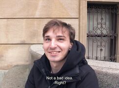 CH 733, Camera guy pays a young guy in a black jacket and a black hoodie, sitting on