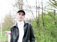 CH 741, Camera guy pays a young guy in a black cap, white Polo knit and a black jacke