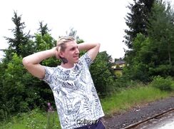 CH 752, Camera guy pays a young guy in a jungle patterned T waiting at the local trai
