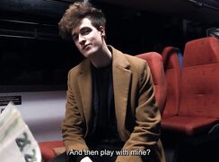 CH 784, Camera guy pays a young guy, in a brown coat, black Jacket and T, getting on