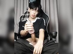 Horny Asian twink in black pumping out a load