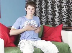 Cute twink jerks his cock for the photographer