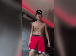 EnzokisBisdaks masturbates in his bedroom. Red shorts, hat on backwards, nice cumshot