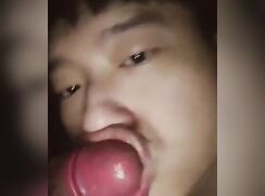 Asian sucks cock with facial