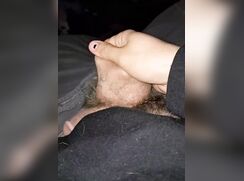 Hairy guy stretches his balls in bed