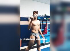 Ripped young Football player playing in locker rooms