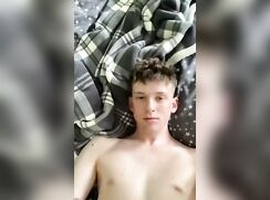 Cute twink squirts cum on his face