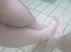 playing footsies with a hot boy's naked feet in a public hot tub