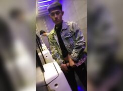 A male is pissing in the toilet 24