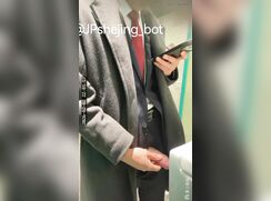 A male is pissing in the toilet 26