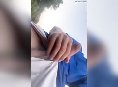Spanish cutie jerks his uncut cock outside
