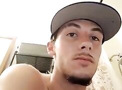 Tatted dude jerks off in the bathroom