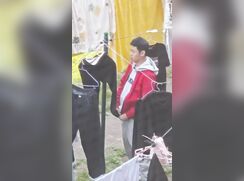 Teen caught jerking-off in the back yard in the clean clothes hanger
