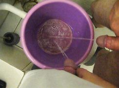two friends pissing in together in a bucket (Part 1)