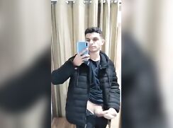 Selfie jerking off in the changing room while shopping