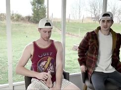 Brothers jerk together on the patio worried they might get caught