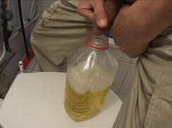 two friends pissing in one bottle