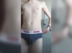 Cutie pissing his puma boxers