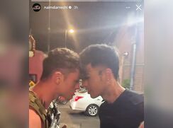 Finally, two men who are squaring up to each other share a kiss